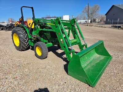 2023 John Deere 5045E Tractor with John Deere 520 Loader, 250 hrs, 3pt, 540 pto, mower, post hole auger, pallet forks, bale spear, bale unroller, quick tach bucket - Thumbnail 1